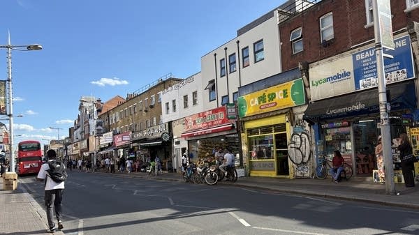 A street in a London neighborhood lined with immigrant-owned businesses